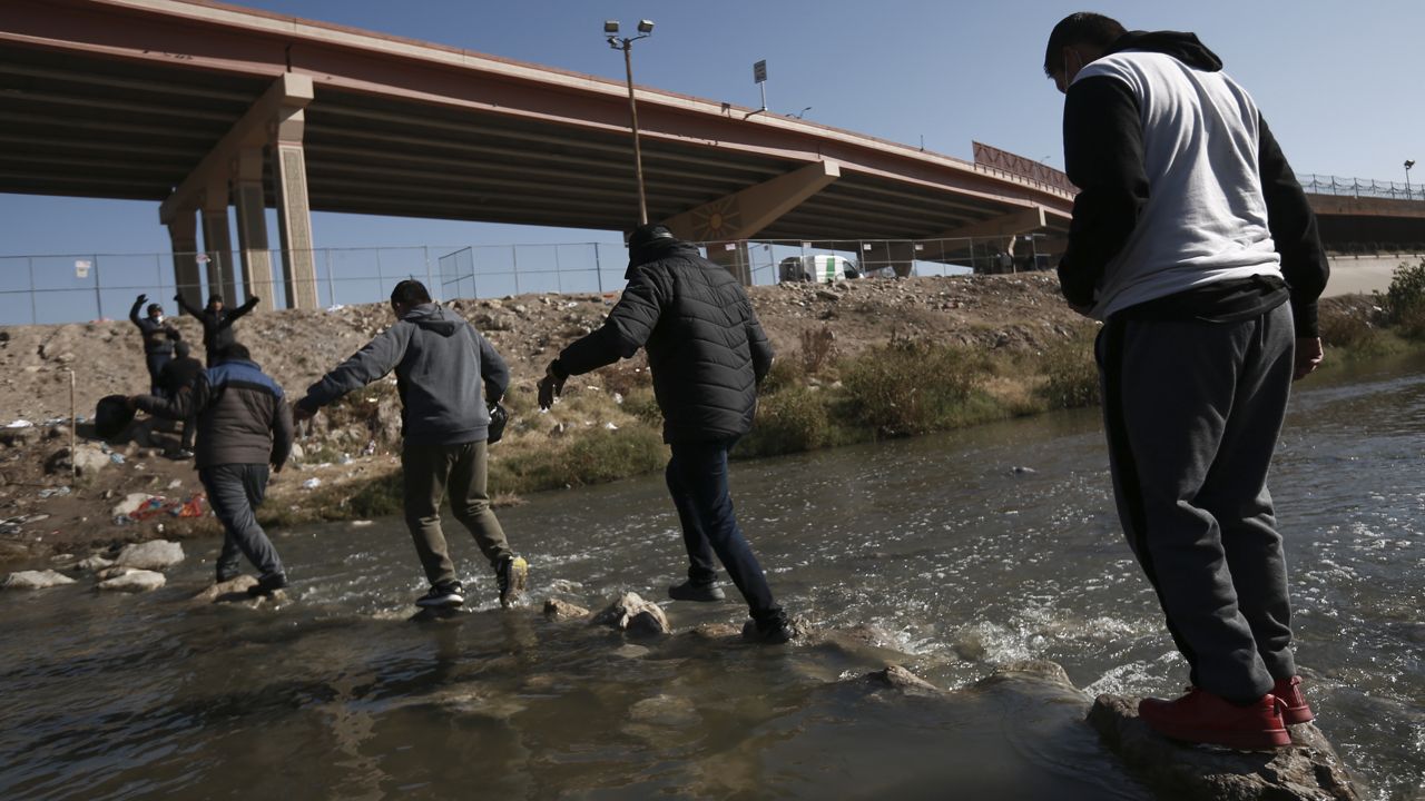 Migrants walk towards the U.S.-Mexico border in Ciudad Juarez, Mexico, Monday, Dec. 18, 2022. Pandemic-era immigration restrictions in the U.S. known as Title 42 are set to expire on Dec. 21. (AP Photo/Christian Chavez)
