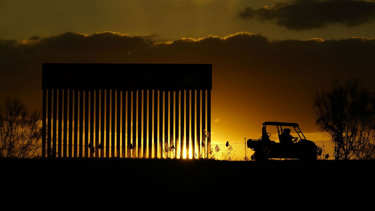 Authorities pass a border wall construction site, in Mission, Texas, Monday, Nov. 16, 2020. President-elect Joe Biden will face immediate pressure to fulfill his pledge to stop border wall construction. But he will confront a series of tough choices left behind by President Donald Trump, who's ramped up construction in his final weeks. (AP Photo/Eric Gay)