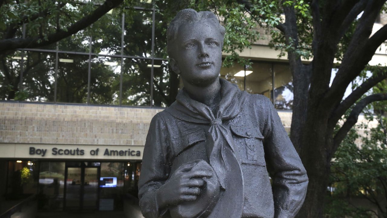 A statue stands outside the Boys Scouts of America headquarters in Irving, Texas, Wednesday, Feb. 12, 2020. (AP Photo/LM Otero)