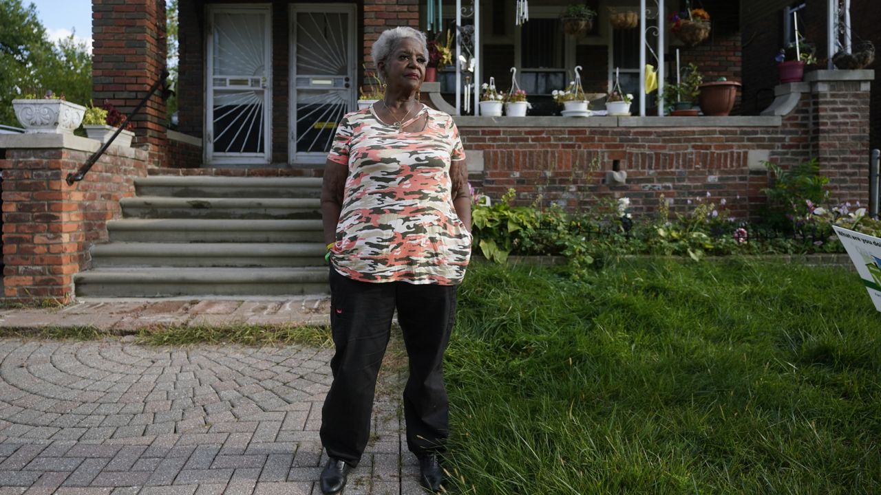 Pamela Jackson-Walters stands outside her home in Detroit, Wednesday, Sept. 21, 2022. (AP Photo/Paul Sancya)