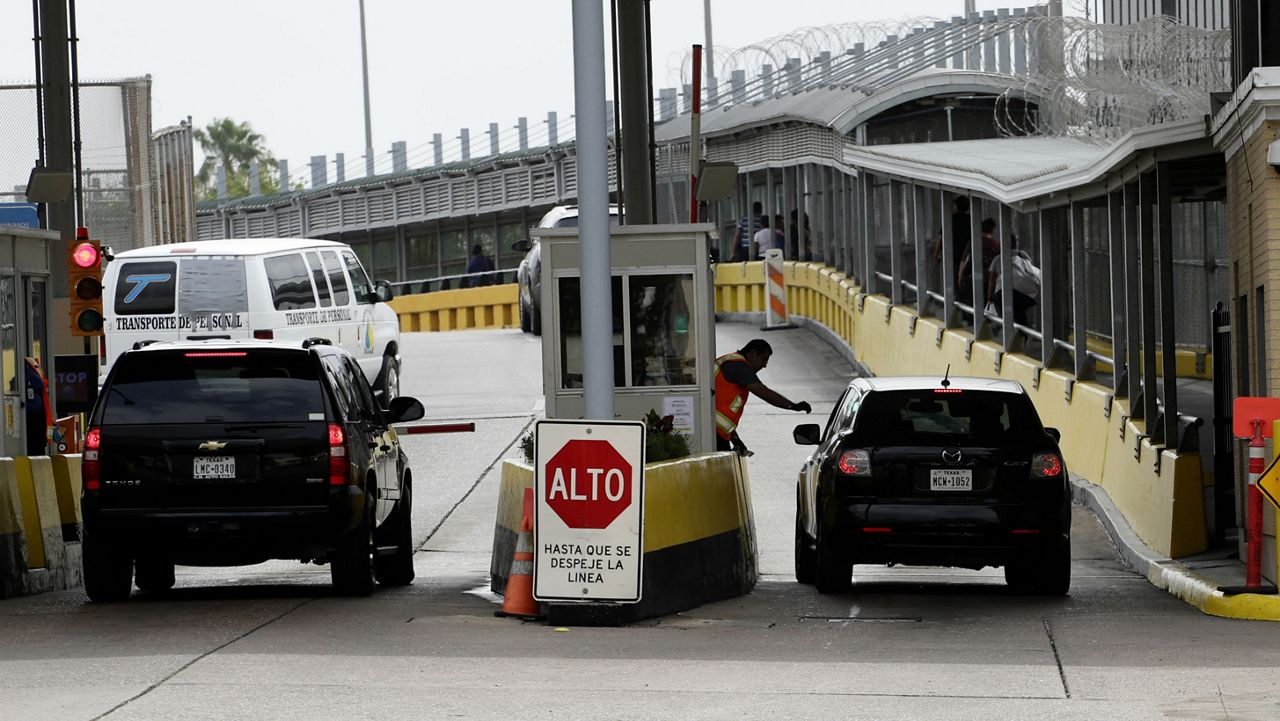 Motorists pay toll at Gateway International Bridge in Brownsville, Texas. (AP)