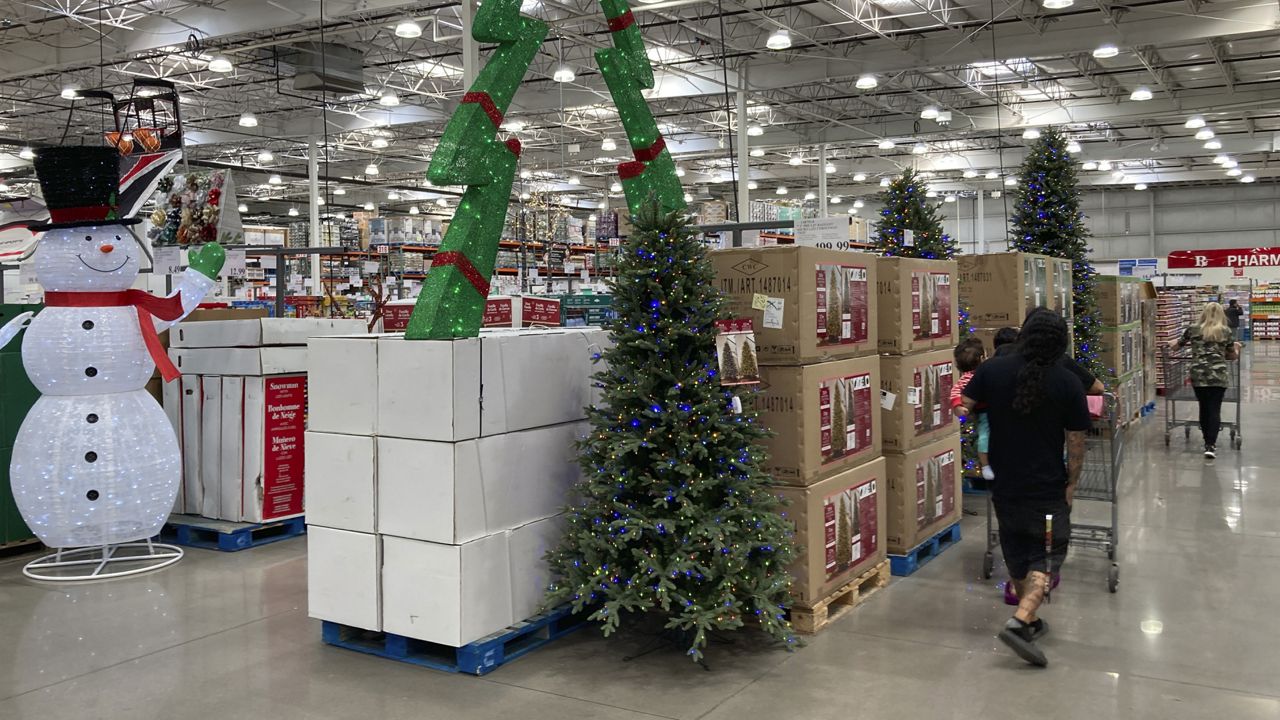 Shoppers pass by displays of Christmas items in a Costco warehouse Wednesday on Sept. 28, 2022.