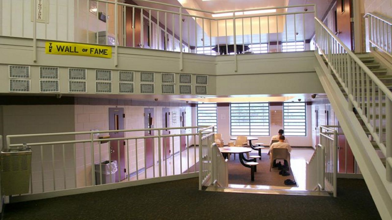 FILE - In this May 18, 2004 file photo inmates sit in one of the cottages at the Circleville Juvenile Correctional Facility in Circleville, Ohio. A coroners report released Thursday, March 18, 2021, indicates Robert Wright, 17, who was found dead last year at the Ohio juvenile detention facility suffered from heart disease and also had "amphetamine intoxication" at the time of his death. Wright was found dead by a guard who entered his cell to tell him it was time to take medication, said a report by the Ohio State Highway patrol that includes coroner's findings. (Tim Revell/The Columbus Dispatch via AP, File)