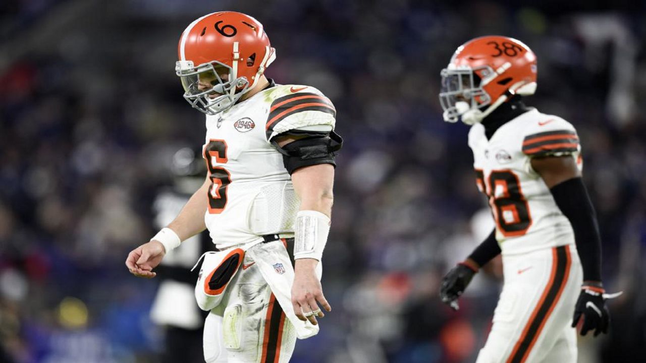 Cleveland Browns quarterback Baker Mayfield (6) and cornerback A.J. Green (38) head to the bench after a series against the Baltimore Ravens during the second half of an NFL football game, Sunday, Nov. 28, 2021, in Baltimore. (AP Photo/Gail Burton)