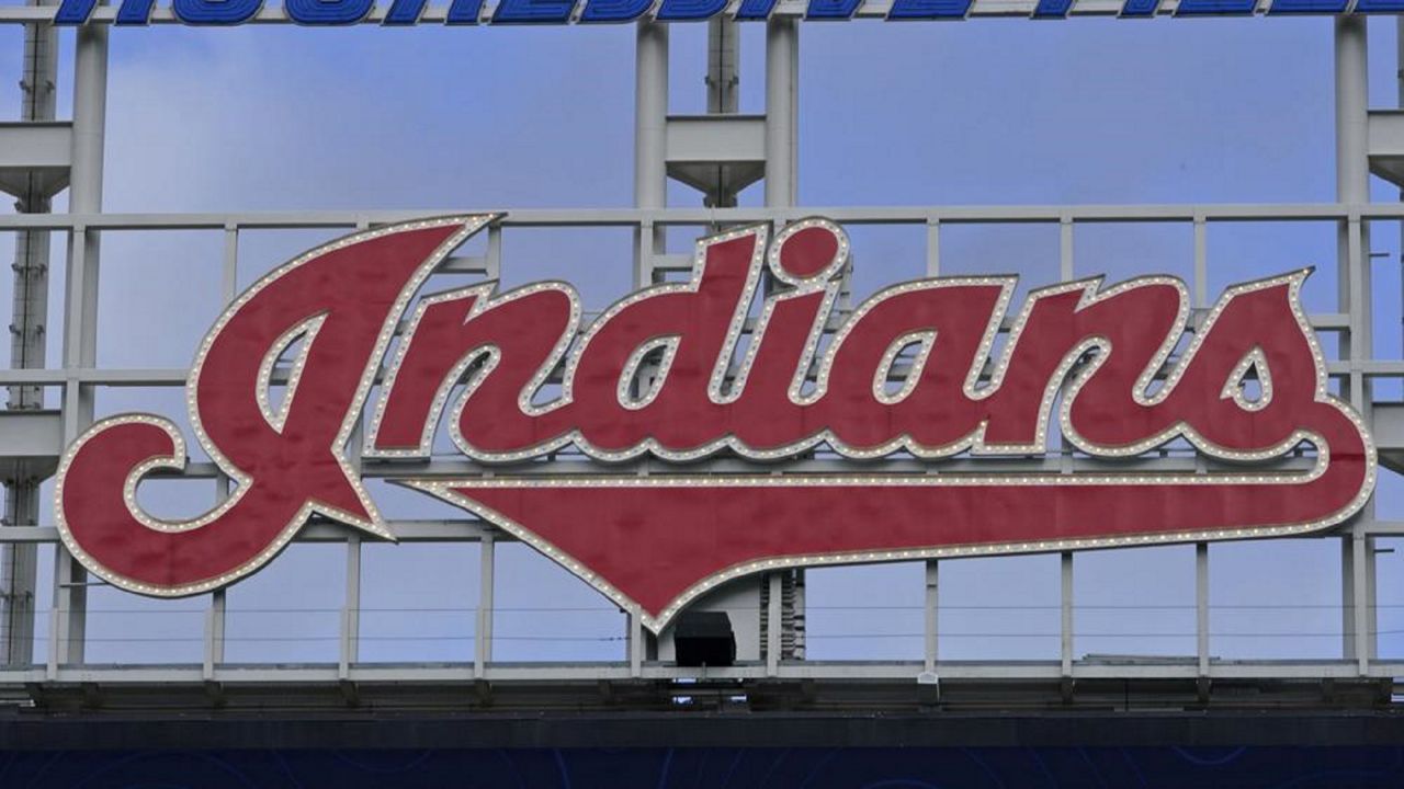 The Indians sign hangs at Progressive Field before the first baseball game of a doubleheader against the Chicago White Sox, Thursday, Sept. 23, 2021, in Cleveland. The Indians has been the team's name since 1915.  (AP Photo/Tony Dejak)
