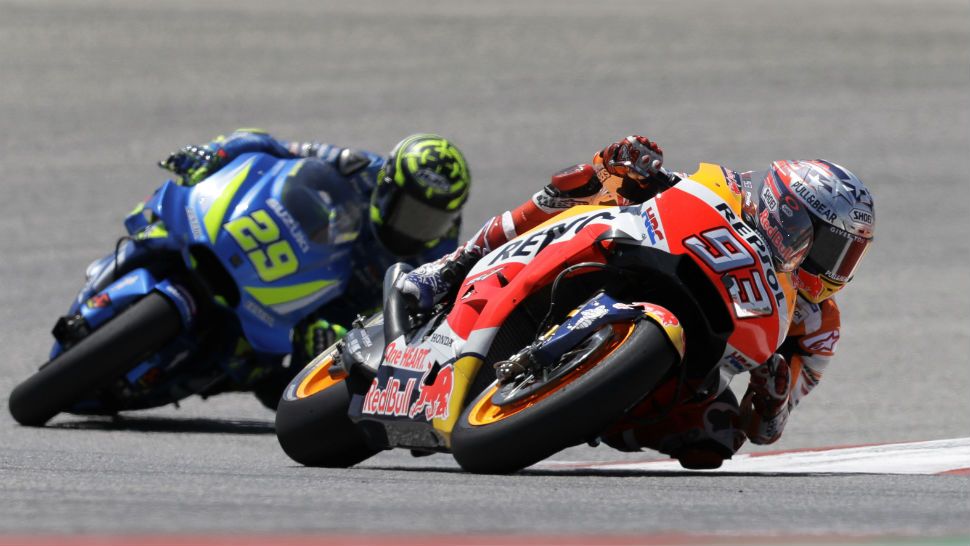Marc Marquez (93), of Spain, leads Andrea Iannone (29), of Italy, through Turn 1 during the Grand Prix of the Americas motorcycle race at the Circuit of the Americas in Austin, Texas, Sunday, April 22, 2018. (AP Photo/Eric Gay)