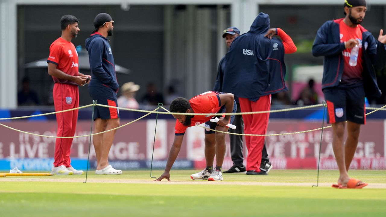 A U.S. player inspecting the pitch at the T20 Cricket World Cup.