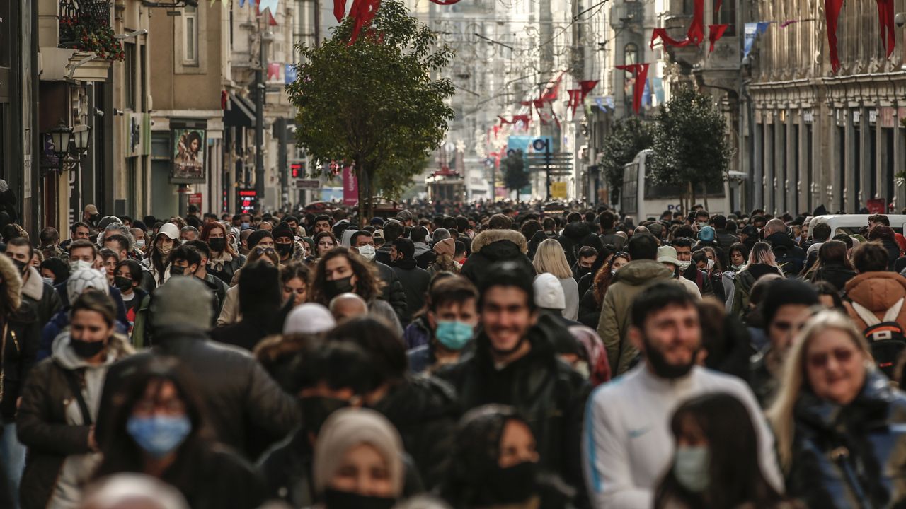 People walk in crowded Istiklal Street Istanbul, Saturday, Feb. 5, 2022. (AP Photo/Emrah Gurel)