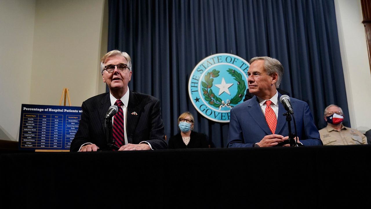 Texas Gov. Greg Abbott, right, listens to Lt. Governor Dan Patrick, left, during a news conference where they provided an update to Texas' response to COVID-19, Thursday, Sept. 17, 2020, in Austin, Texas. (AP Photo/Eric Gay)