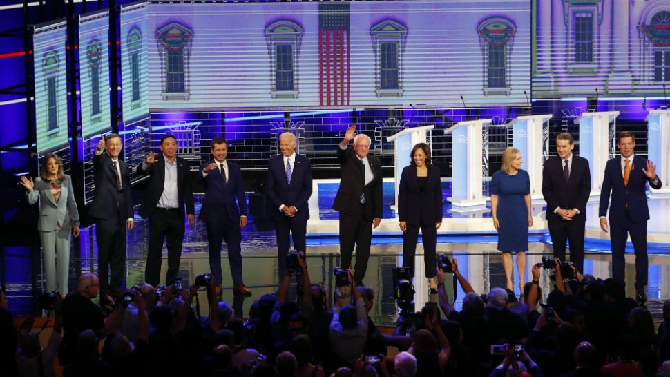 The 10 candidates, including Rep. Eric Swalwell on the far right, who fought amongst each other to be heard during the second part of the first DNC debate in Miami on Thursday, June 27, 2019. (AP)