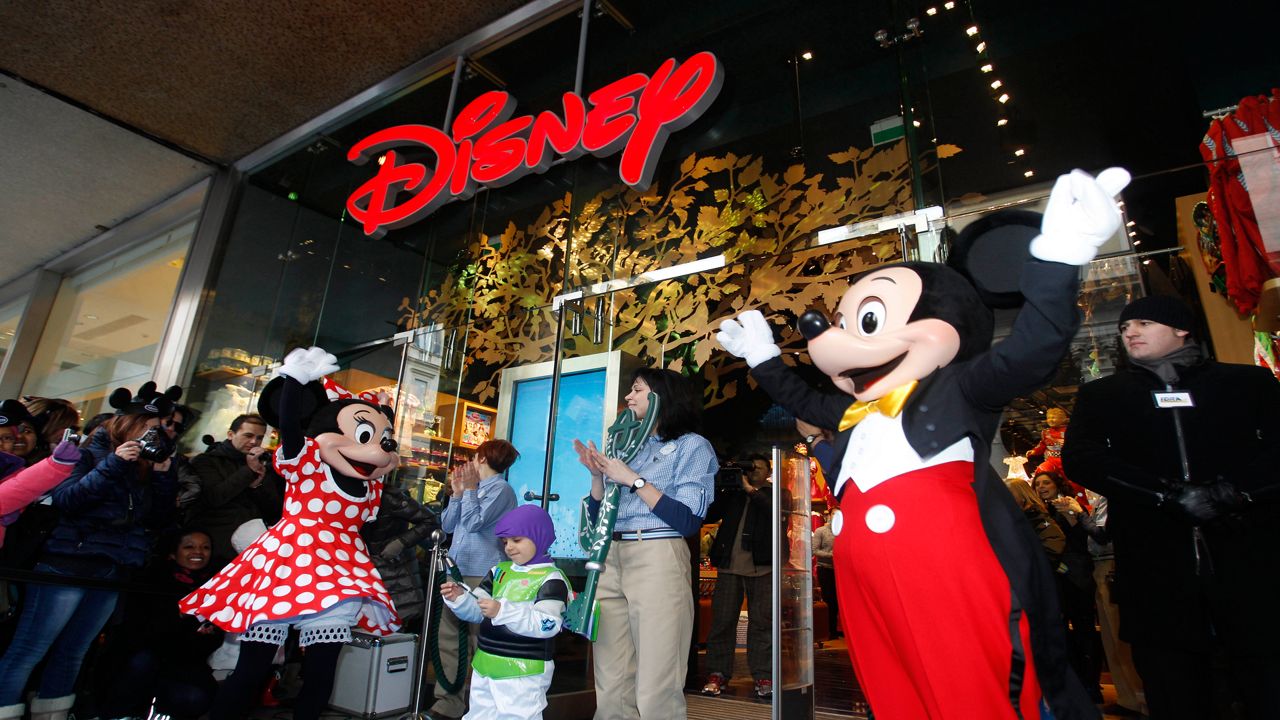 Micky Mouse and Minnie muppets are seen during a Disney store unveiling in Milan, Saturday, Feb.12, 2012. (AP Photo/Luca Bruno)