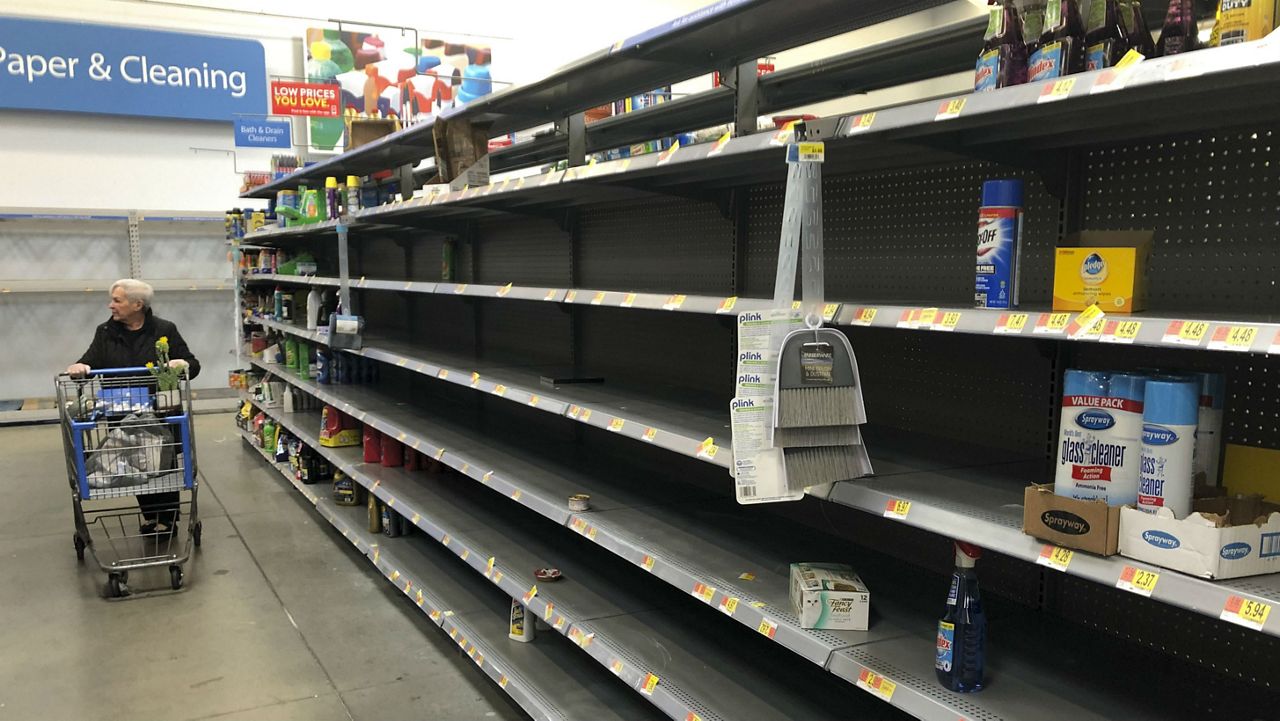 Shelves are nearly empty at a Walmart in Warrington, Pa., Tuesday, March 17, 2020. Concerns over the coronavirus have led to consumer panic buying of grocery staples in stores across the country. (AP Photo/Matt Rourke)