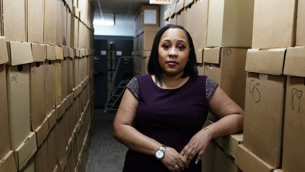 FILE: Fulton County District Attorney Fani Willis poses for a photo at her office, Feb. 24, 2021 in Atlanta. (AP Photo/John Bazemore, File)