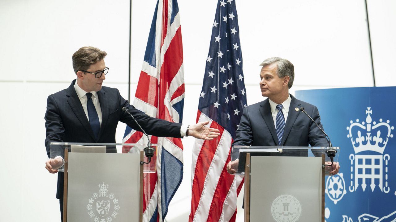 MI5 Director General Ken McCallum, left, and FBI Director Christopher Wray attend a joint press conference at MI5 headquarters, in central London, Wednesday July 6, 2022. (Dominic Lipinski/PA via AP)