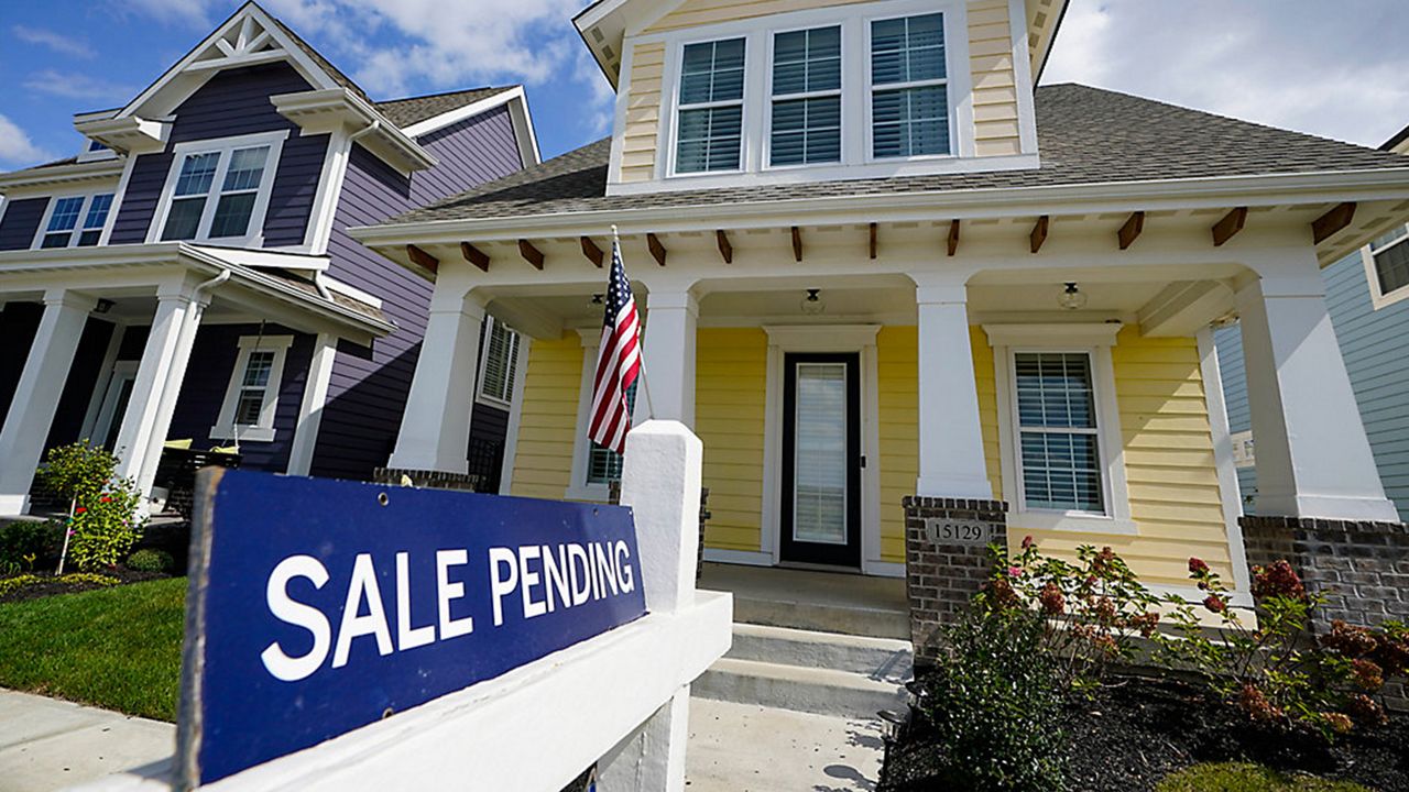 A home with a pending sale sign in its front yard (Associated Press)