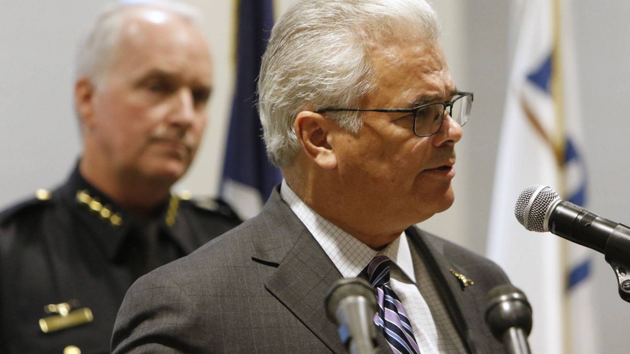 City Manager David Cooke speaks as interim police chief Ed Kraus stands behind at a news conference at the Bob Bolen Public Safety Complex in Fort Worth, Texas, Monday, Oct. 14, 2019, about Saturday's shooting death of Atatiana Jefferson, a black woman, by a white police officer. (AP Photo/David Kent)