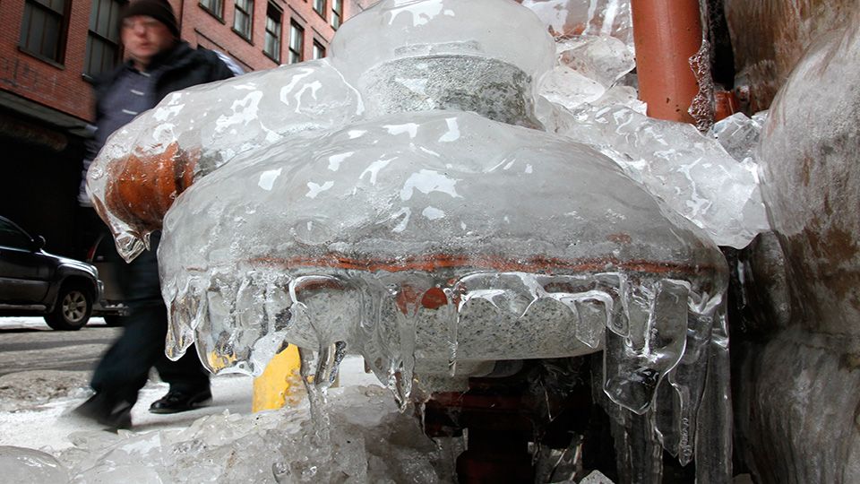 Image of frozen pipes on a street. (AP Image/File)