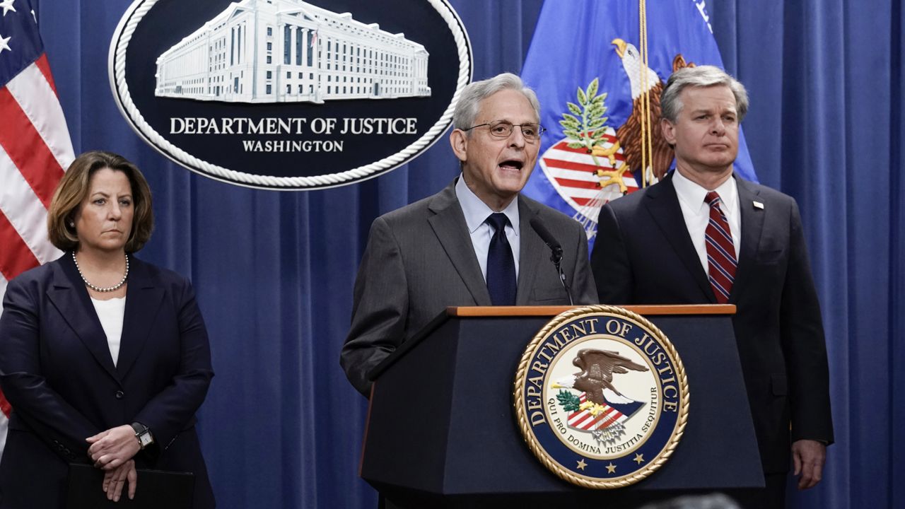 Attorney General Merrick Garland speaks to reporters as they announce charges against two men suspected of being Chinese intelligence officers for attempting to obstruct a U.S. criminal investigation and prosecution of Chinese tech giant Huawei, at the Department of Justice in Washington, Monday, Oct. 23, 2022. (AP Photo/J. Scott Applewhite)