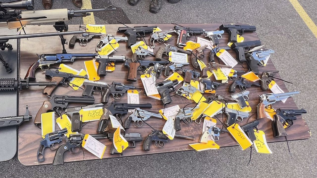This photo on Aug. 28, 2022 shows some of the 296 firearms, including 177 ghost guns, that were surrendered to law enforcement at a gun buy-back event. (Office of New York Attorney General via AP)