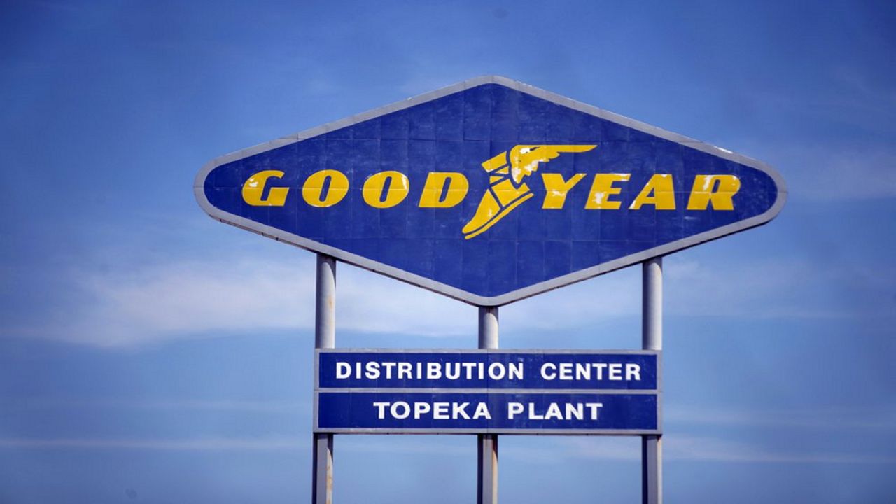 FILE - In this Aug. 20, 2020 file photo, signage for the Goodyear Distribution Center stands in Topeka, Kan. Goodyear Tire and Rubber Co. is acquiring Cooper tires in a deal valued at $2.5 billion that will combine the two century-old Ohio companies. (Evert Nelson/The Topeka Capital-Journal via AP, File)