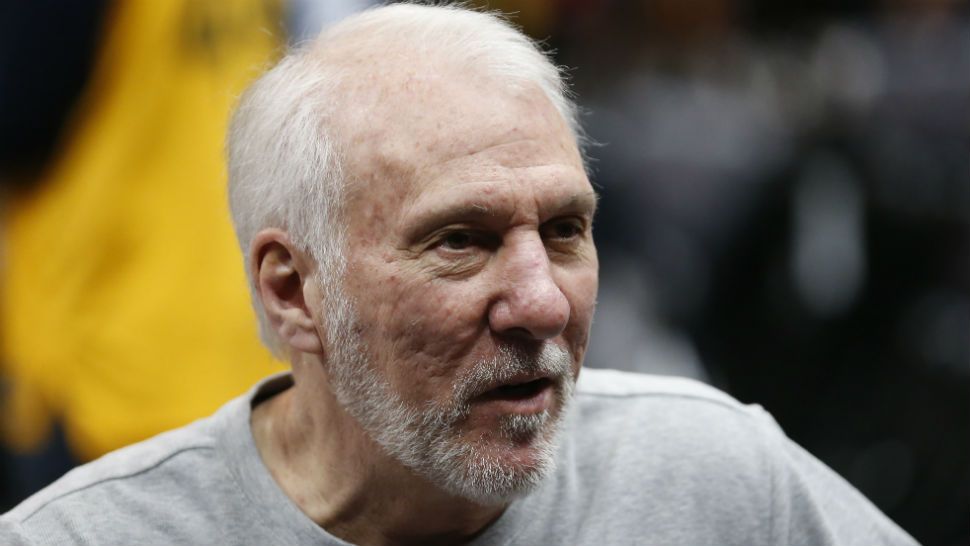 San Antonio Spurs head coach Gregg Popovich speaks with fans during practice before the start of their NBA basketball game against the Utah Jazz Friday, Feb. 21, 2020, in Salt Lake City. (AP Photo/Rick Bowmer)