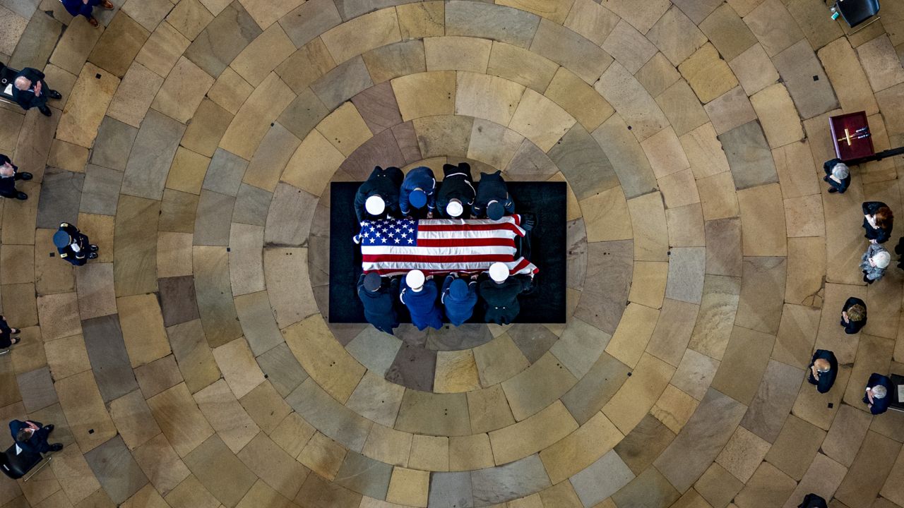 The casket of former Sen. Harry Reid, D-Nev., arrives in the Rotunda of the U.S. Capitol, where he will lie in state, Wednesday, Jan. 12, 2022, in Washington. (AP Photo/Andrew Harnik, Pool)