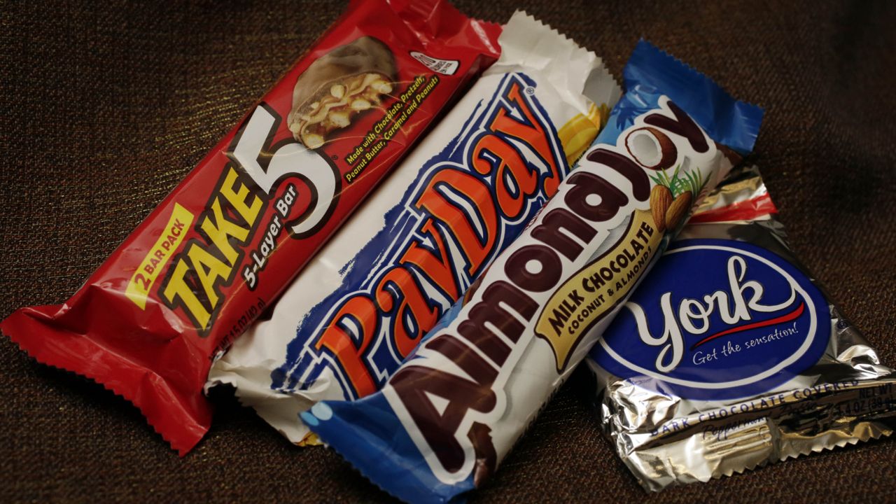 Hershey's candy bars Take 5, PayDay, Almond Joy and a York Peppermint Patty are displayed for a photo in New York, Tuesday, Dec. 2, 2014. (AP Photo/Richard Drew)