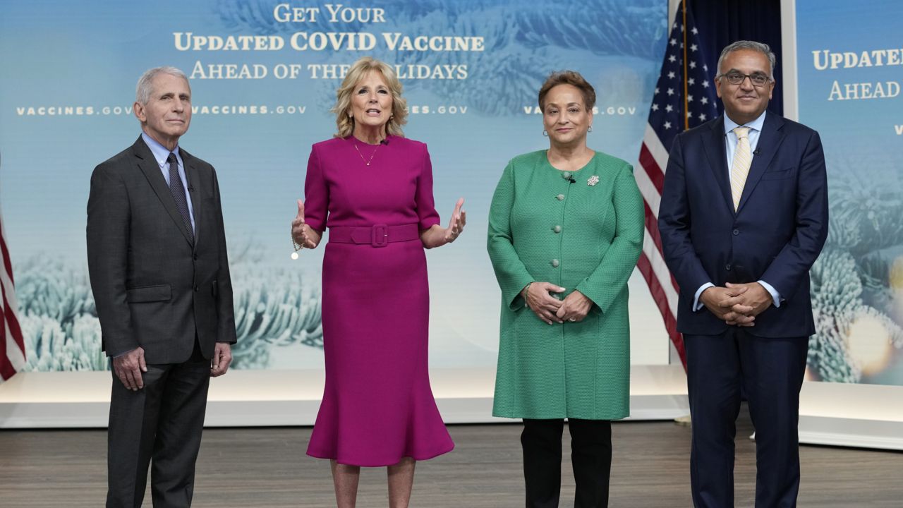 First lady Jill Biden, second from left, speaks during the opening remarks of a virtual White House town hall in the South Court Auditorium on the White House complex in Washington, Friday, Dec. 9, 2022, on getting an updated COVID-19 vaccine this holiday season. (AP Photo/Susan Walsh)