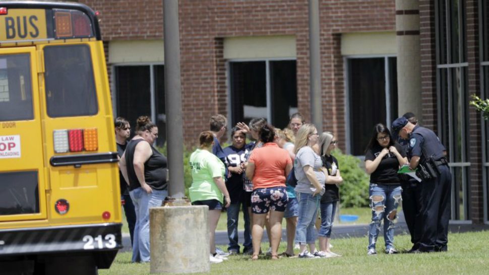 Students are checked before entering Santa Fe High School in Santa Fe, Texas, on Saturday, May 19, 2018. (AP Photo/David J. Phillip)