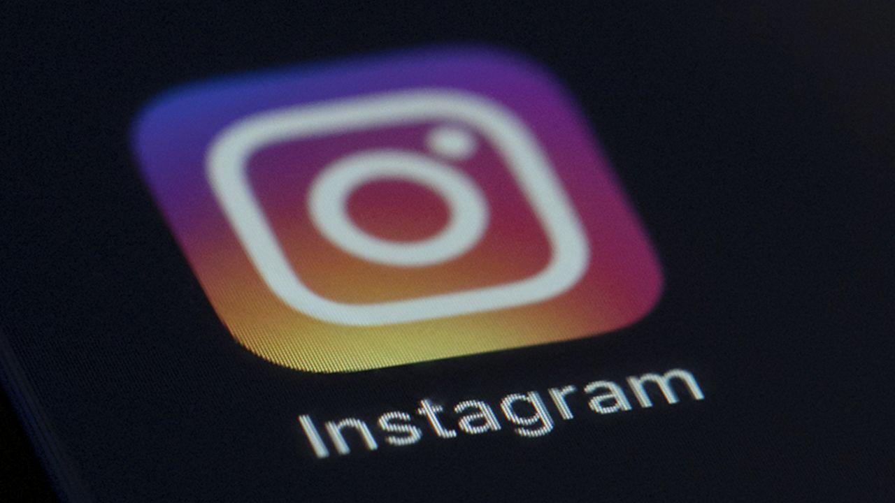 FILE - This photo shows the Instagram app icon on the screen of a mobile device on Aug. 23, 2019. (AP Photo/Jenny Kane, File)