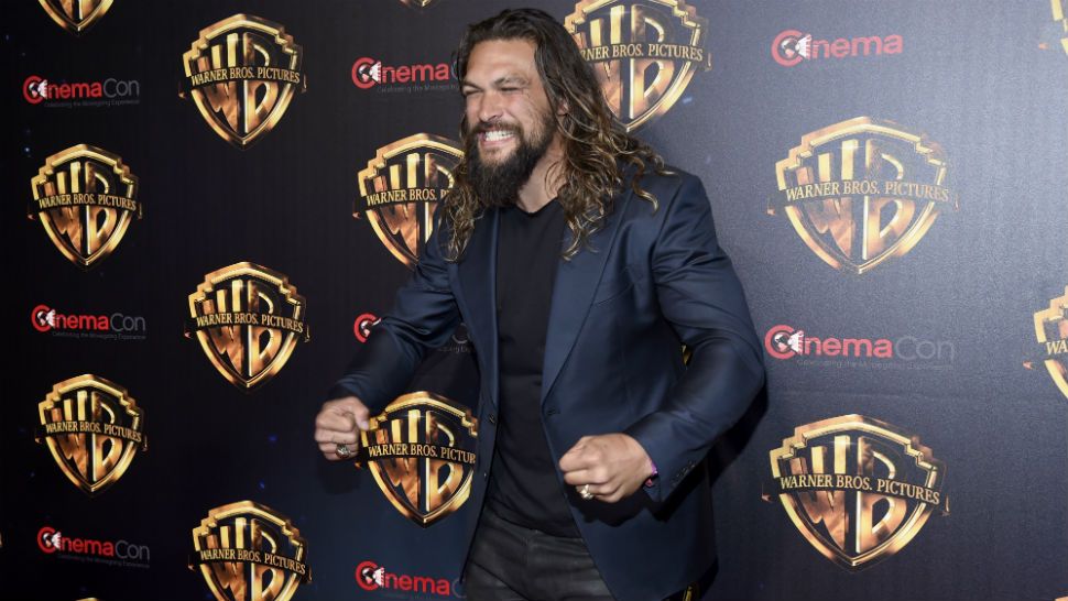 Jason Momoa poses on a red carpet on April 24, 2018, in Las Vegas. (Photo by Chris Pizzello/Invision/AP)