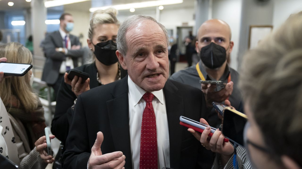 Senate Foreign Relations Committee Ranking Member Jim Risch, R-Idaho, is surrounded by reporters asking about the crisis in Ukraine, at the Capitol in Washington, Tuesday, Feb. 15, 2022. (AP Photo/J. Scott Applewhite)