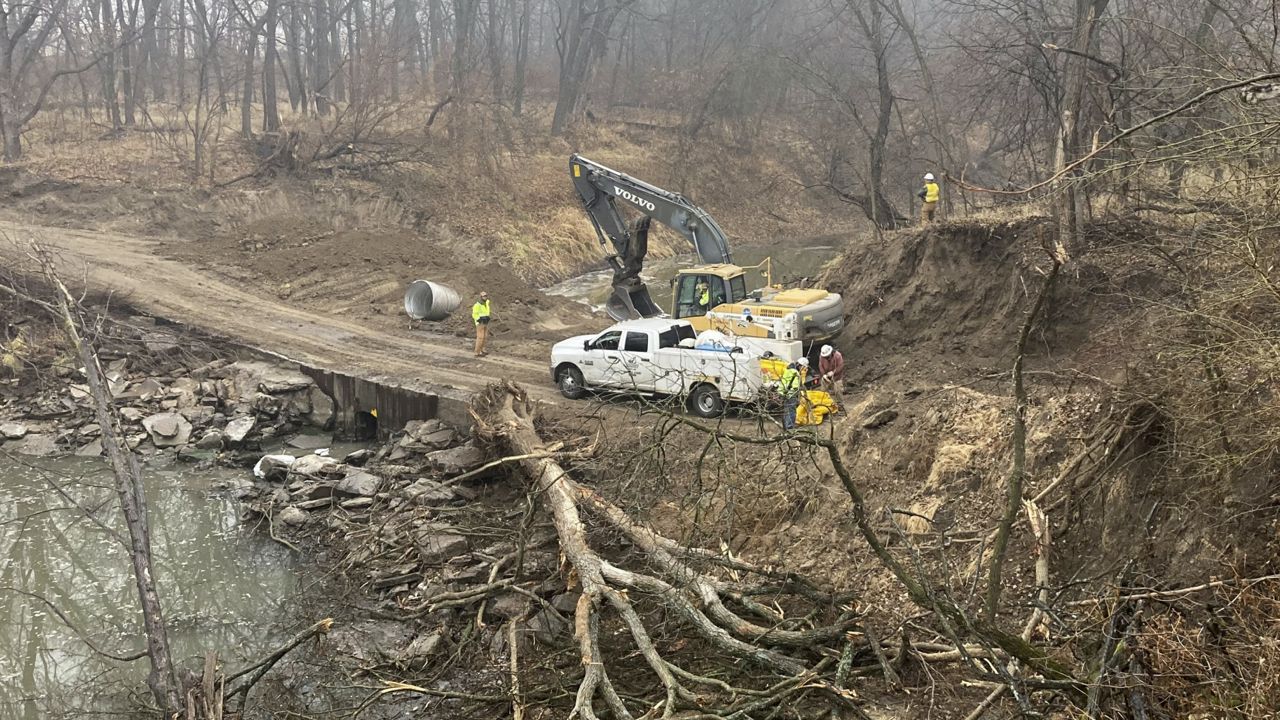 Washington County Road Department constructs an emergency dam to intercept an oil spill after a Keystone pipeline ruptured at Mill Creek in Washington County, Kanas, on Thursday, Dec 8, 2022. (Kyle Bauer/KCLY/KFRM Radio via AP)