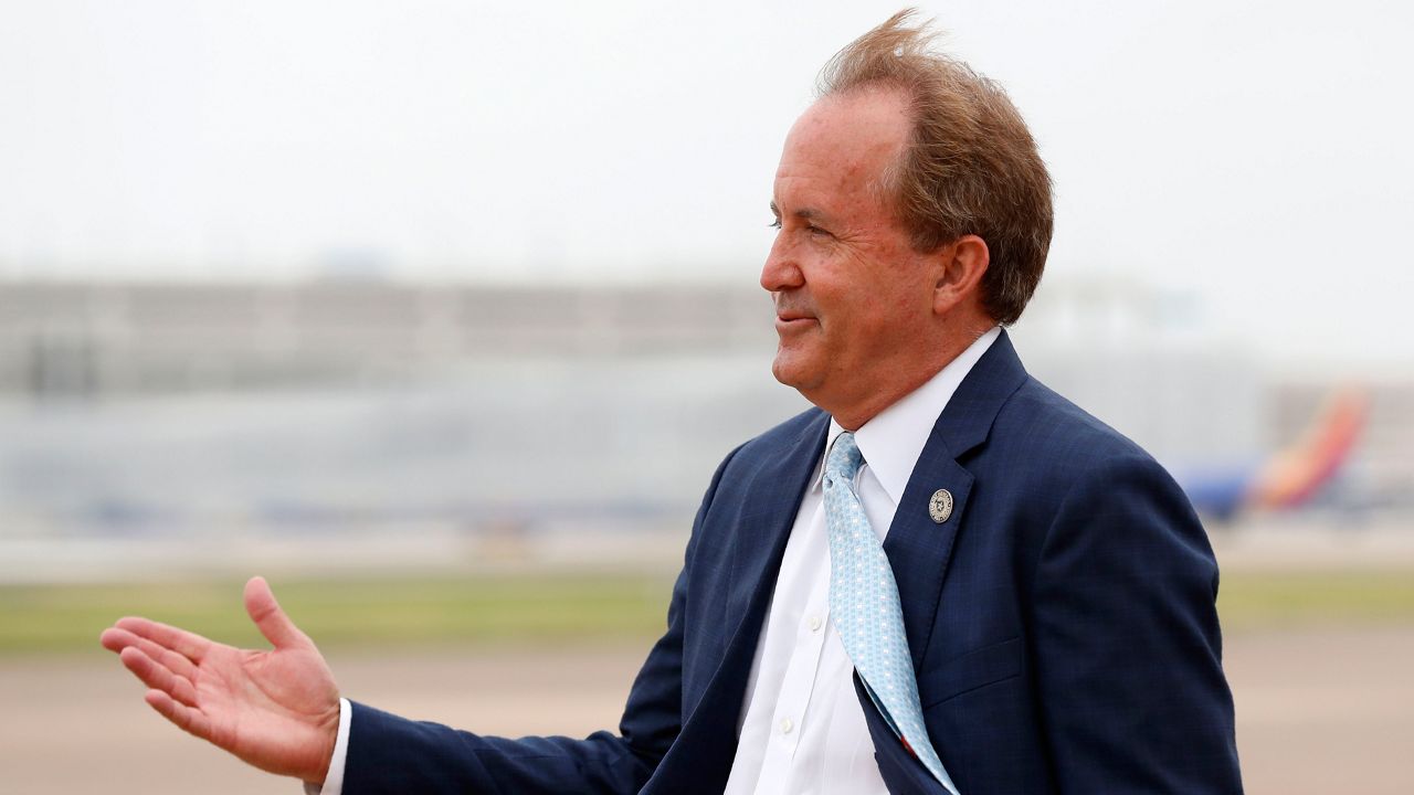 In this June 28, 2020, file photo, Texas State Attorney General Ken Paxton waits on the flight line for Vice President Mike Pence to arrive in Dallas. The Texas bar association has opened an investigation into whether Paxton's failed efforts to overturn the 2020 presidential election amounted to professional misconduct. After Paxton, a Republican, petitioned the U.S. Supreme Court in December to block Joe Biden's victory, a Democratic Party activist filed a complaint with the bar association calling the case frivolous. The bar initially declined to investigate, but a tribunal overturned that decision late last month. (AP Photo/Tony Gutierrez, File)