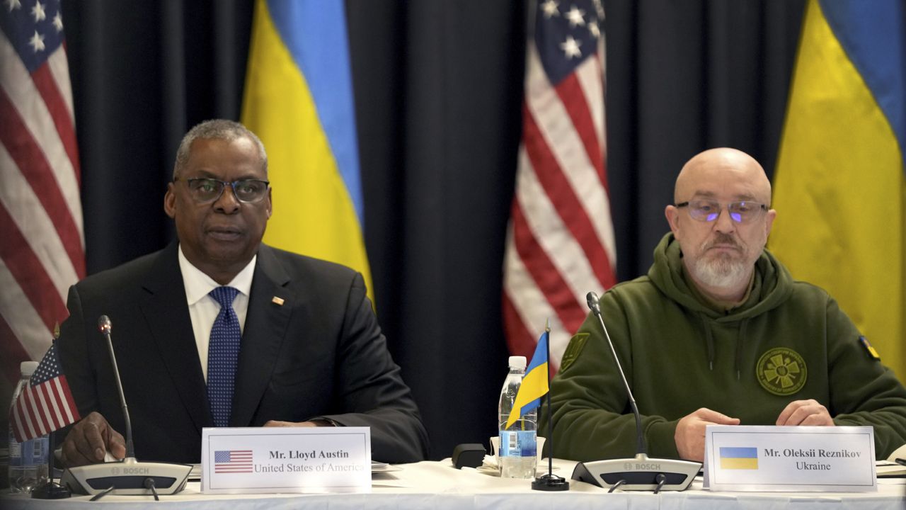 U.S. Defense Secretary Lloyd Austin, left, and the Ukrainian participant Oleksii Reznikov, right, attend the meeting of the 'Ukraine Defense Contact Group' at Ramstein Air Base in Ramstein, Germany, Friday, Jan. 20, 2023. (AP Photo/Michael Probst)