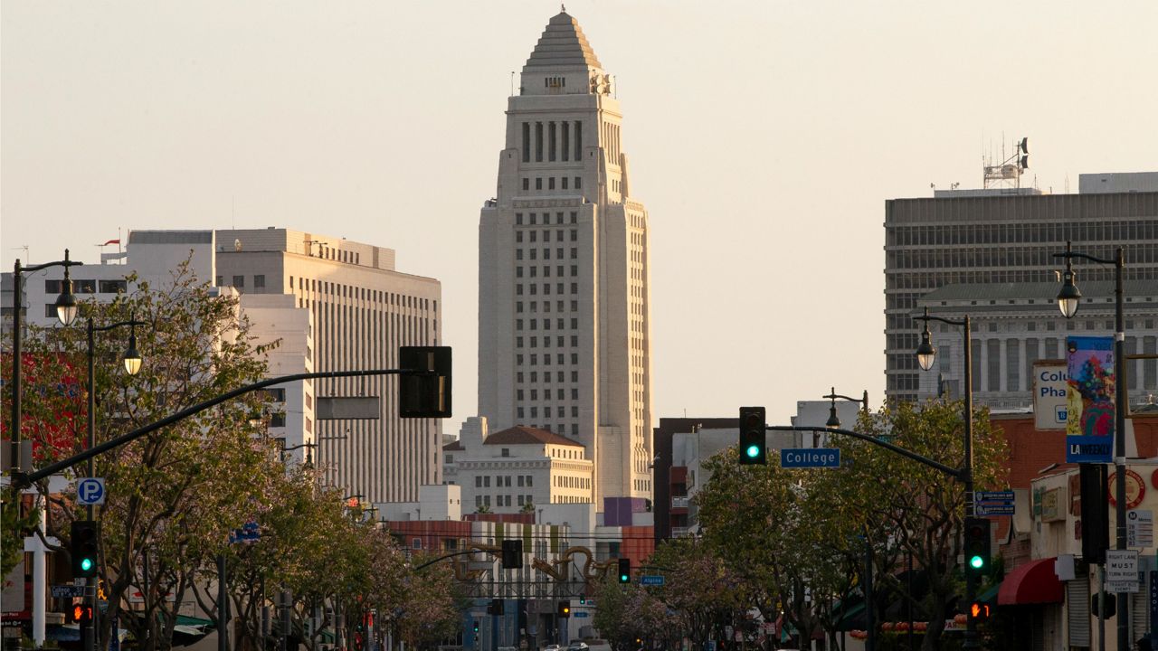 City Hall is seen from North Broadway and College in downtown Los Angeles on Thursday, April 2, 2020. (AP Photo/Damian Dovarganes)