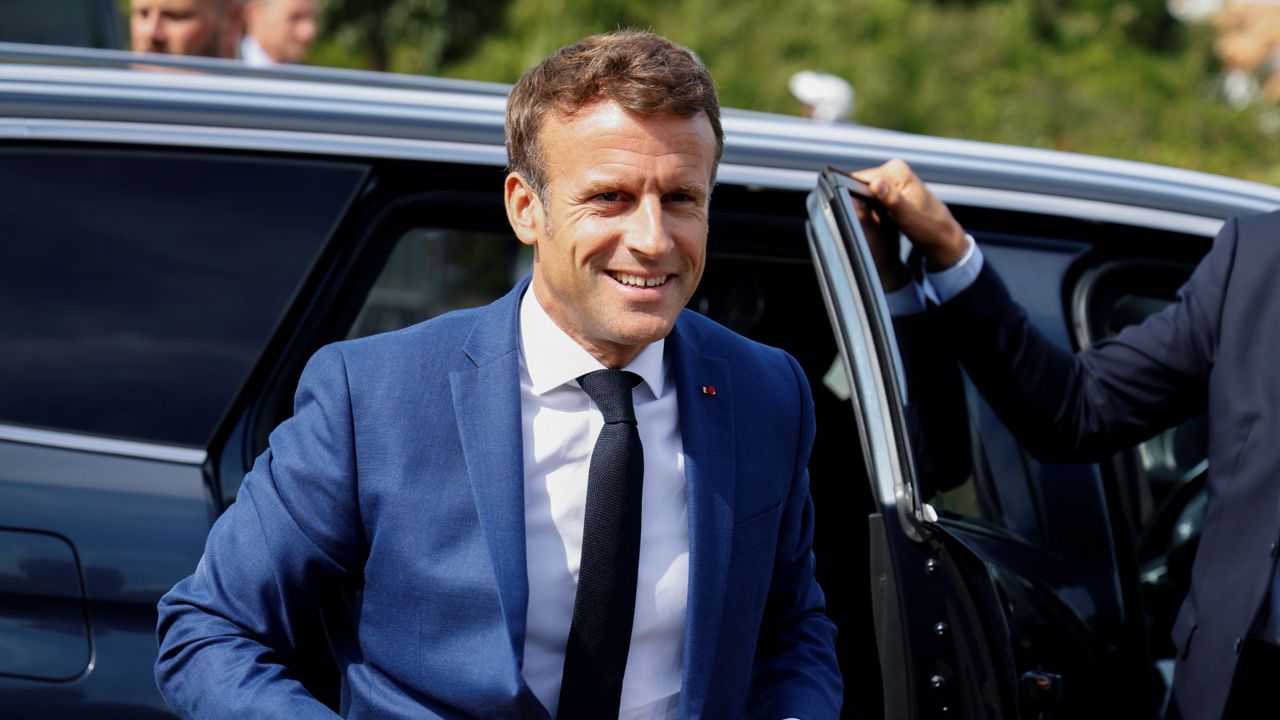 French President Emmanuel Macron arrives to meet students at the Eric Tabarly vocational school in Les Sables-d'Olonne, western France,Tuesday, Sept. 13, 2022. (Ludovic Marin, Pool via AP)