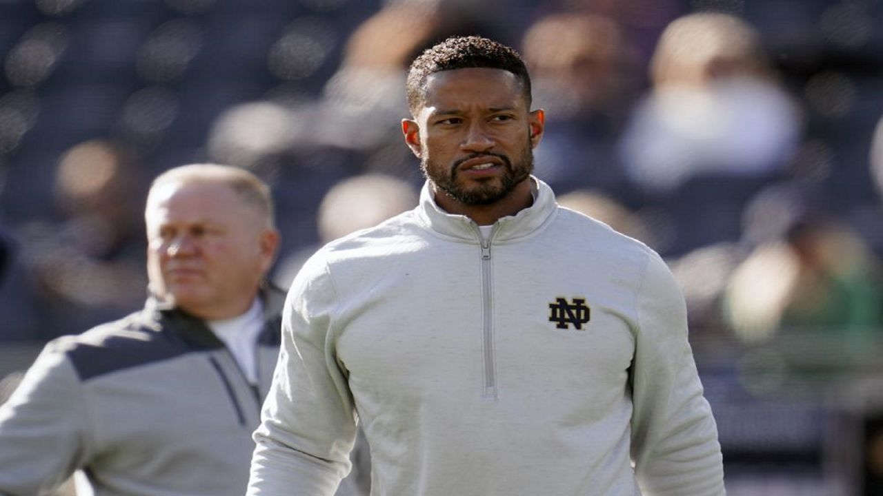 FILE - Notre Dame defensive coordinator Marcus Freeman watches during warmups before an NCAA college football game against Navy in South Bend, Ind., Saturday, Nov. 6, 2021. (AP Photo/Paul Sancya, File)