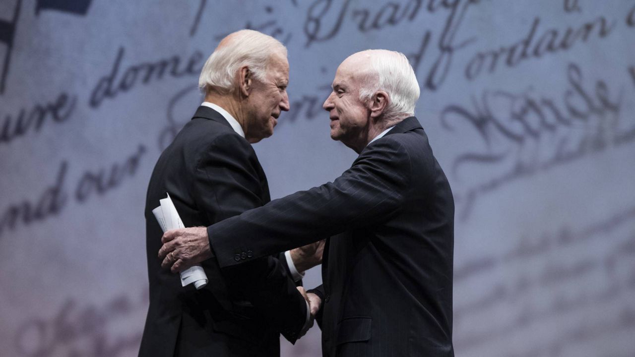 Former Sen. John McCain, R-Ariz., shakes hands with former Vice President Joe Biden after receiving the Liberty Medal in Philadelphia. (via Associated Press)