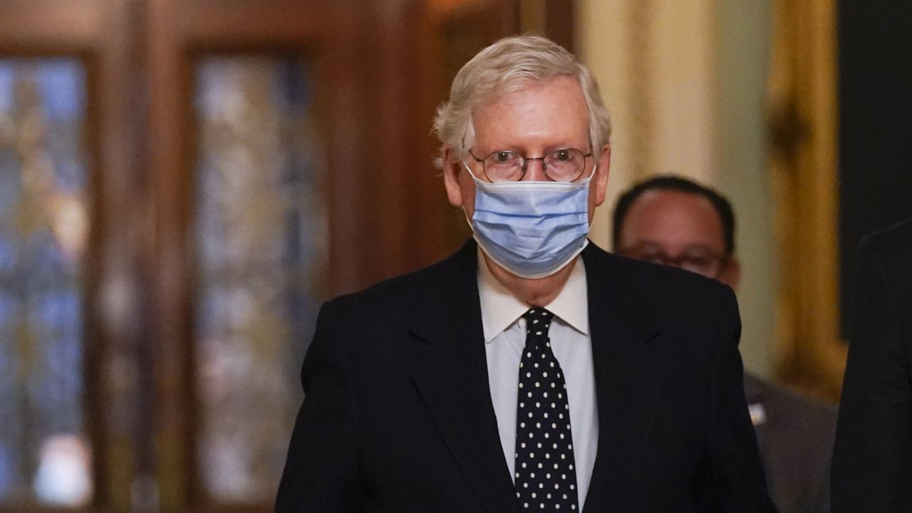 FILE - In this Jan. 6, 2021, photo, Senate Majority Leader Mitch McConnell of Ky., walks from the Senate floor to his office on Capitol Hill in Washington. (AP Photo/Manuel Balce Ceneta, File)