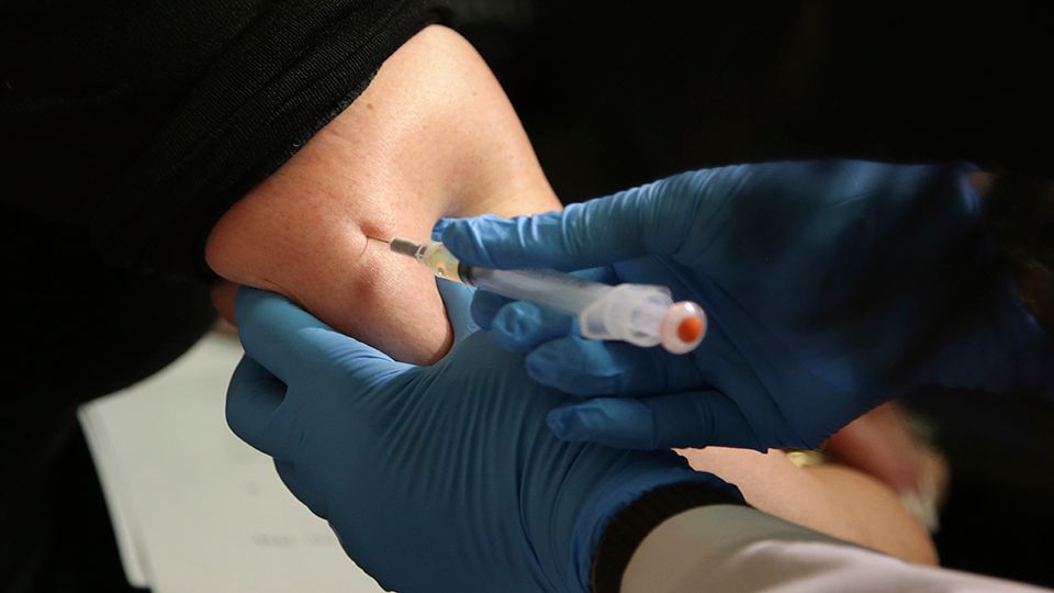 FILE - In this March 27, 2019, file photo, a woman receives a measles, mumps and rubella vaccine at the Rockland County Health Department in Pomona, N.Y. The Centers for Disease Control and Prevention reports that U.S. measles cases have surged this year, and at this pace will set a record for most illnesses in 25 years. Nearly two-thirds of the cases reported have been in New York, and most of those have been unvaccinated people in Orthodox Jewish communities. (AP Photo/Seth Wenig, File)