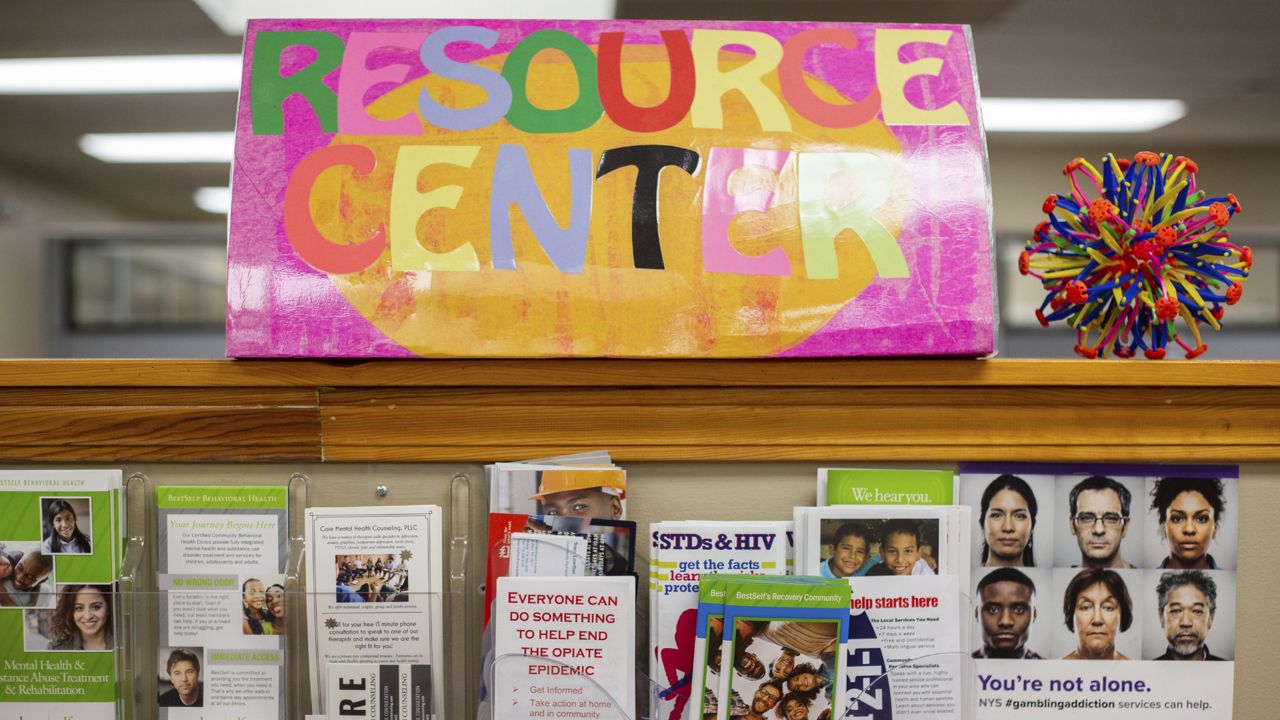 Brochures and posters are shown on display at BestSelf Behavioral Health on Wednesday, Aug. 11, 2021, in Buffalo, N.Y. (AP Photo/Joshua Bessex)