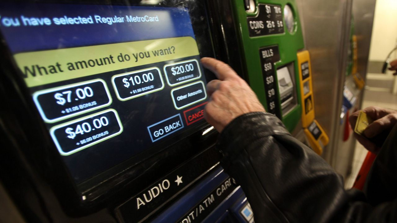 Larry Hellenberg of Manhattan buys a MetroCard at the Union Square subway station on Wednesday, March 25, 2009 in New York.