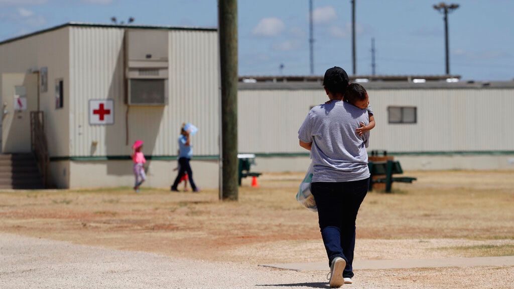 In this Aug. 23, 2019 file photo, immigrants seeking asylum walk at the ICE South Texas Family Residential Center, in Dilley, Texas. (AP Photo/Eric Gay, File)