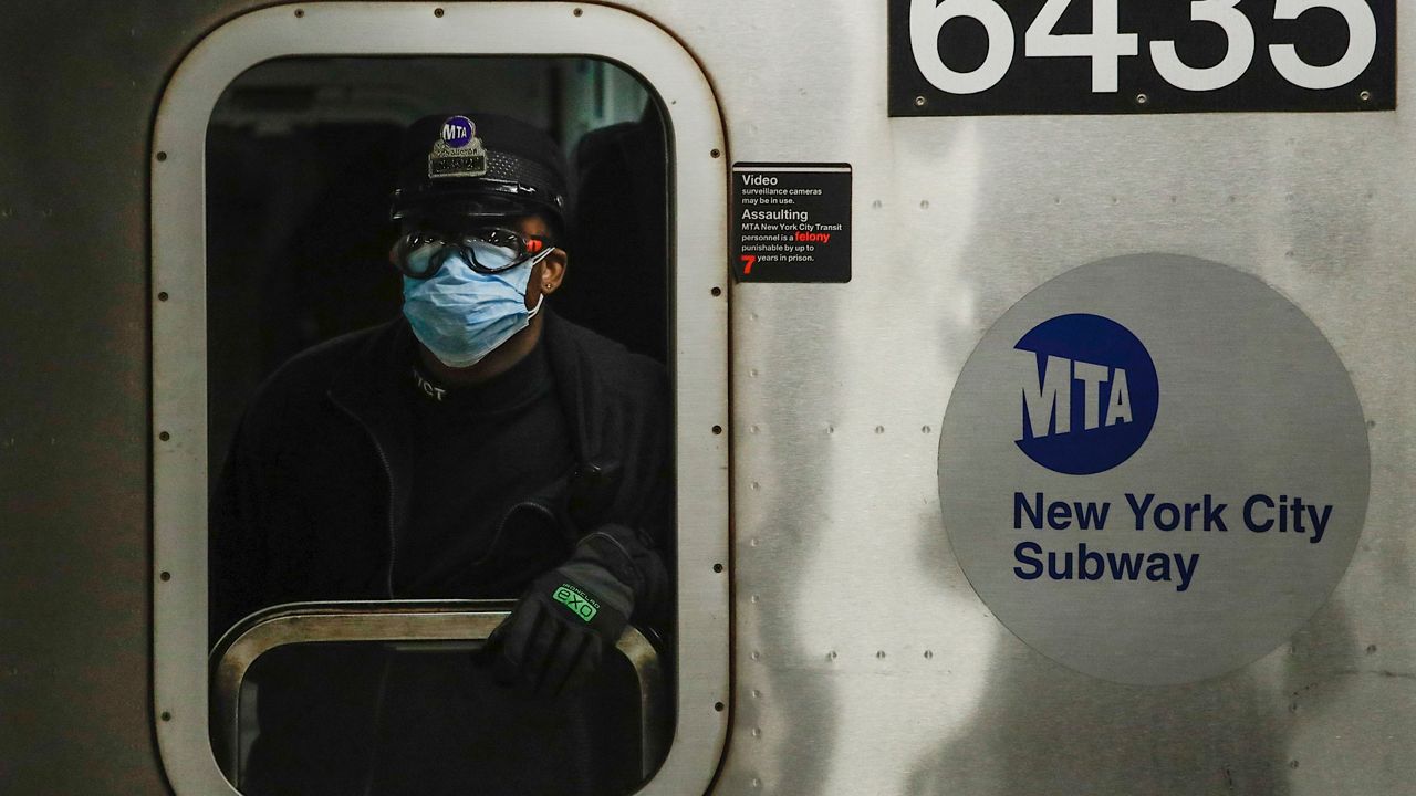 MTA worker wears personal protective equipment at the Grand Army Plaza station. 