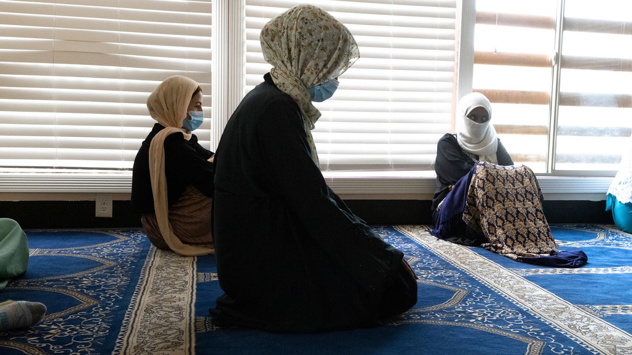Muslim women pray at the Islamic Center of Kent. (AP Photo/Karen Ducey)