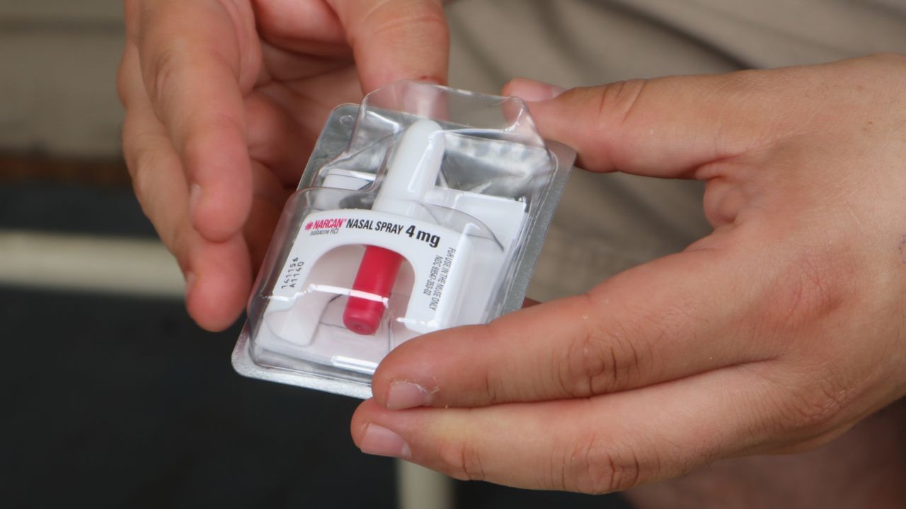 Joe Solomon, co-director of Charleston-based Solutions Oriented Addiction Response, holds a dose of the opioid overdose reversal drug Narcan at the Unitarian Universalist Congregation of Charleston in Charleston, W.Va., Tuesday Sept. 6, 2022. (AP Photo/Leah Willingham)