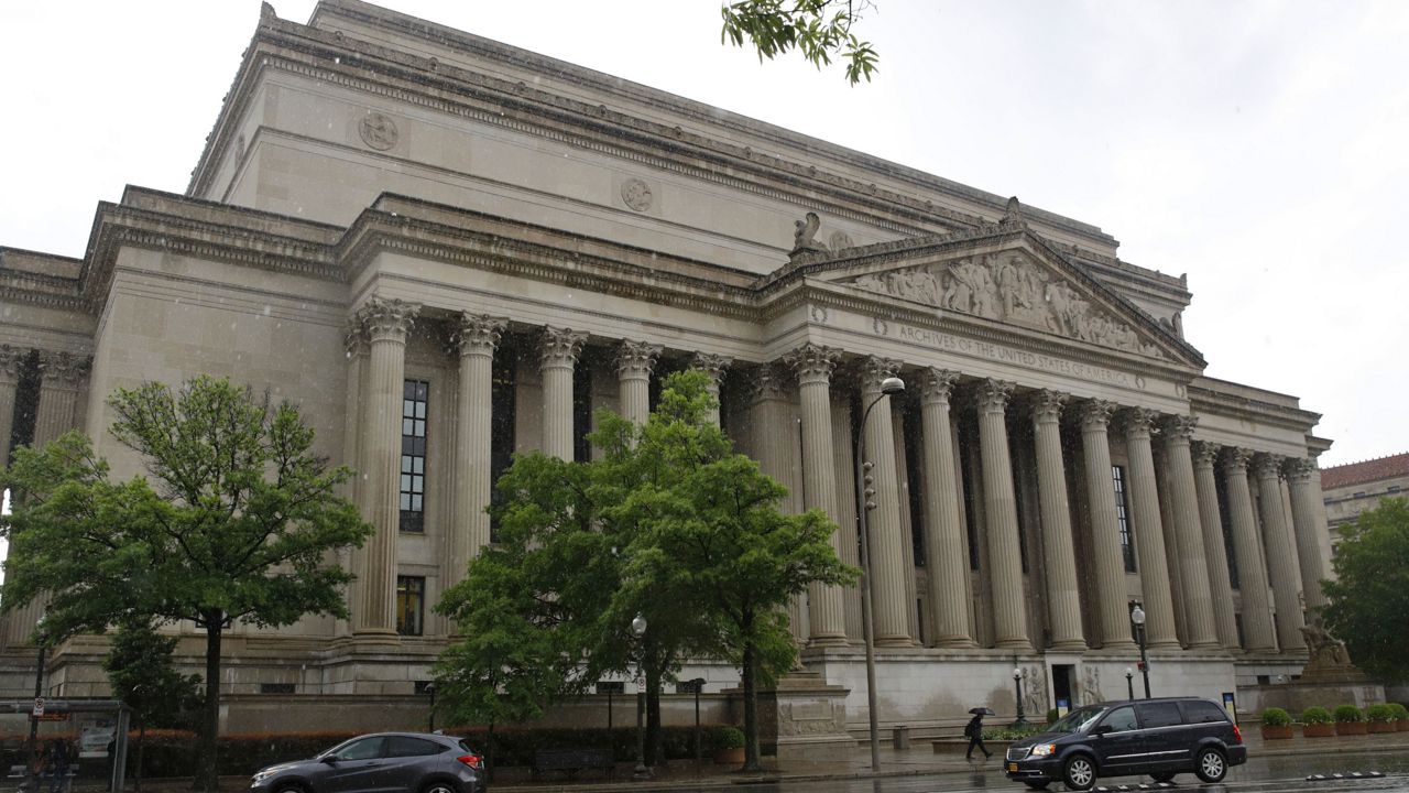 Traffic passes by the National Archives building, Friday, April 26, 2019, in Washington. (AP Photo/Patrick Semansky)