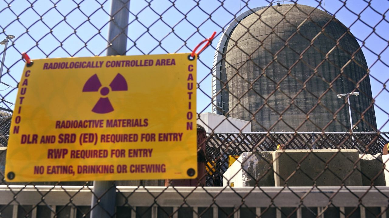 A sign warning of radioactive materials is seen on a fence around a nuclear reactor containment building on Monday, April 26, 2021. (AP Photo/Seth Wenig, File)