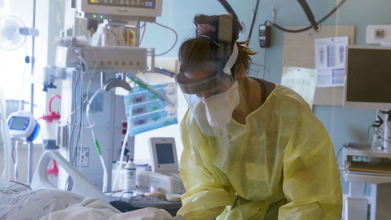 FILE: A nurse cares for a critically ill patient in the ICU at Oregon Health and Science University in Portland, Ore., Aug. 19, 2021. (Kristyna Wentz-Graff/Oregon Public Broadcasting via AP, Pool)